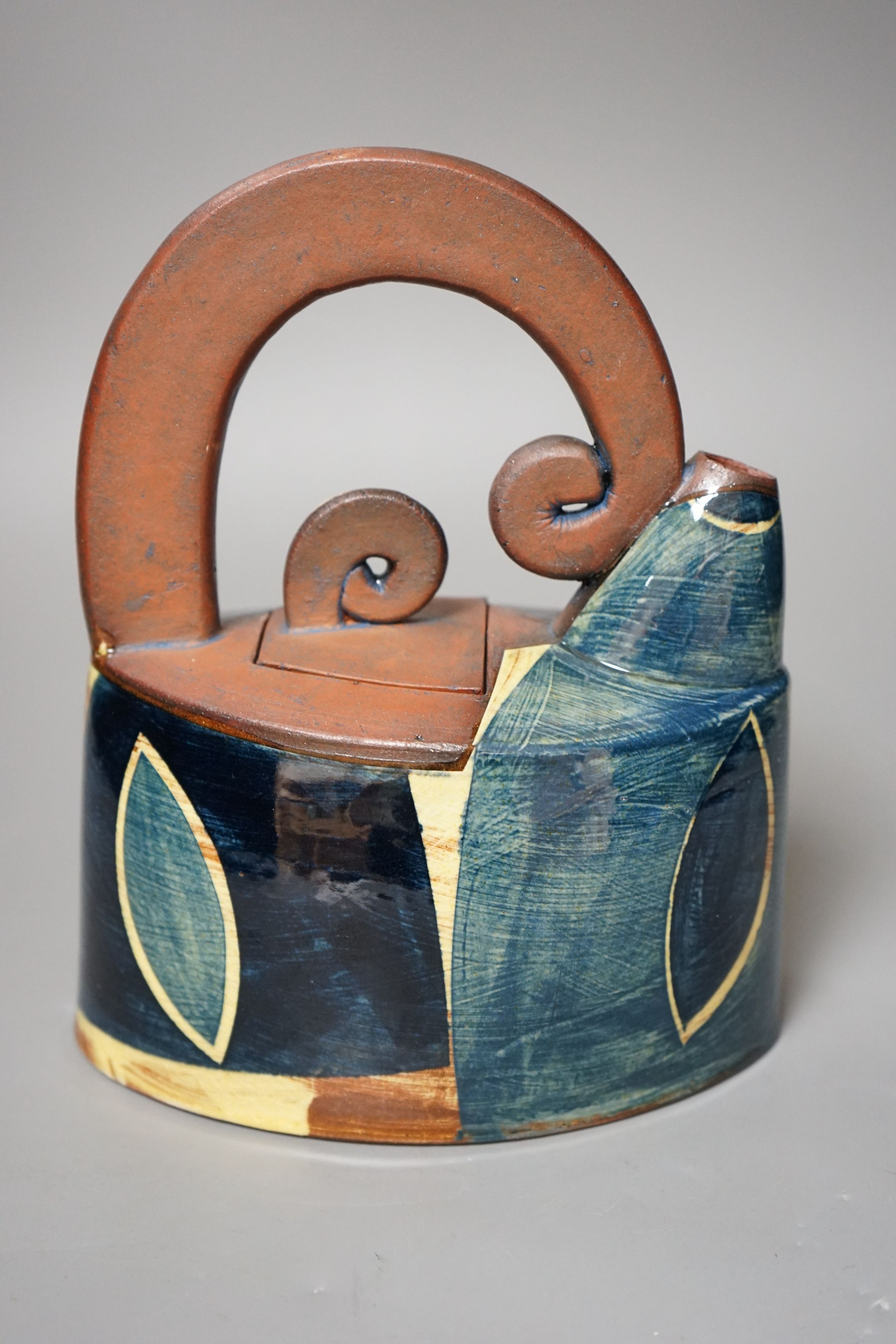 Richard Phethean (b.1953), an abstract green yellow and blue glazed earthenware teapot, purchased from Craft Potters Association contemporary ceramics centre, 63 Great Russell Street, London, 23cm tall